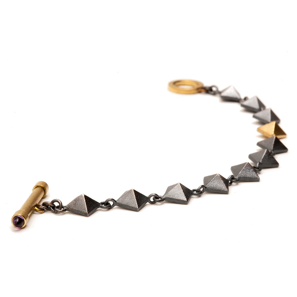 Maria Samora made this 18k Gold and Sterling Silver Pyramid Bracelet in her Taos, NM Samora Studios for the Heard Museum 2018.